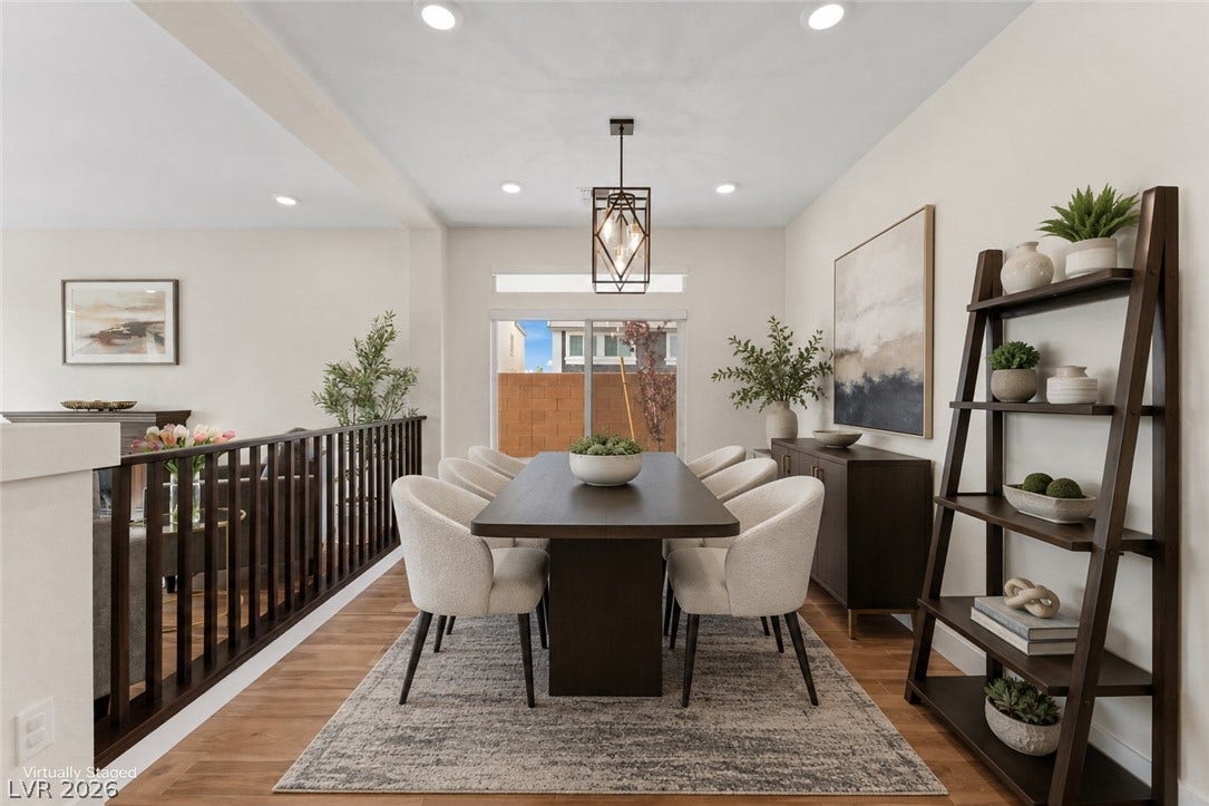 8724 Fortplaid Street, Las Vegas, NV 89139 Warm wood flooring and recessed lighting define this inviting, open-concept dining area.