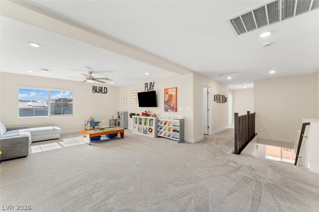 8724 Fortplaid Street, Las Vegas, NV 89139 Recessed lighting and soft carpeting elevate this versatile upper-level bonus room.