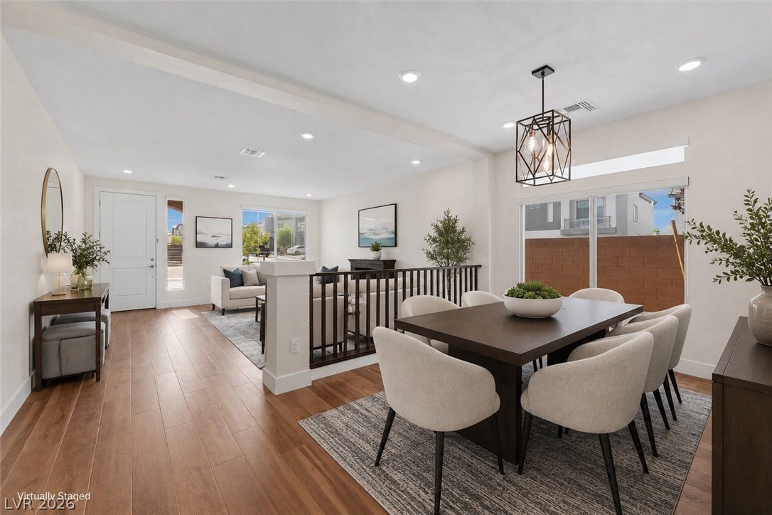 8724 Fortplaid Street, Las Vegas, NV 89139 Warm wood flooring and clean lines define this open-concept main level dining space.