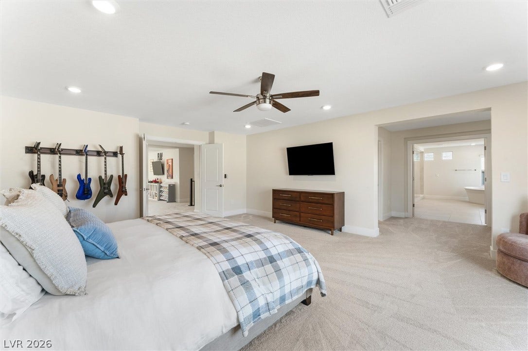 8724 Fortplaid Street, Las Vegas, NV 89139 Recessed lighting and soft carpeting create a peaceful ambiance in this main suite.