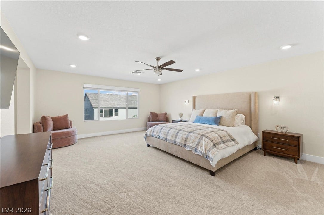 8724 Fortplaid Street, Las Vegas, NV 89139 Recessed lighting and neutral carpeting define this comfortable primary bedroom suite.