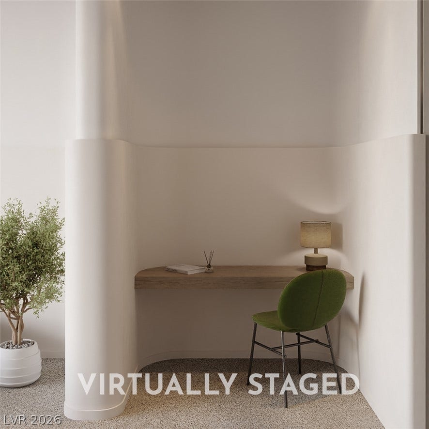 410 Net Zero Drive, Henderson, NV 89012 Smooth curved walls and a floating wooden desk create a serene, minimalist architectural niche.