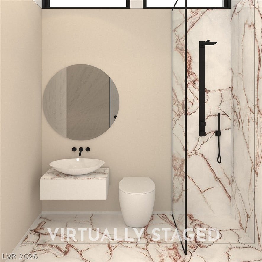 410 Net Zero Drive, Henderson, NV 89012 Elegant stone finishes and modern fixtures define this contemporary bathroom space.