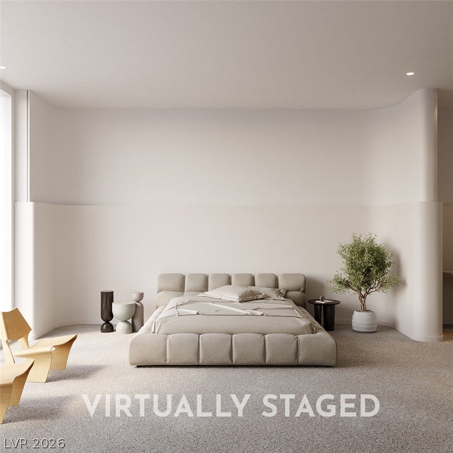 410 Net Zero Drive, Henderson, NV 89012 Smooth architectural curves and soft recessed lighting define this minimalist bedroom space.