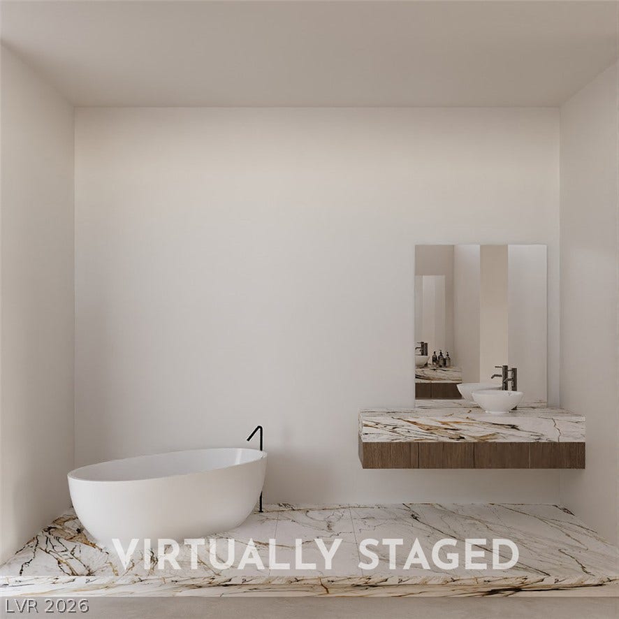 410 Net Zero Drive, Henderson, NV 89012 Minimalist design elements highlight this modern space featuring stone finishes and a sleek soaking tub.