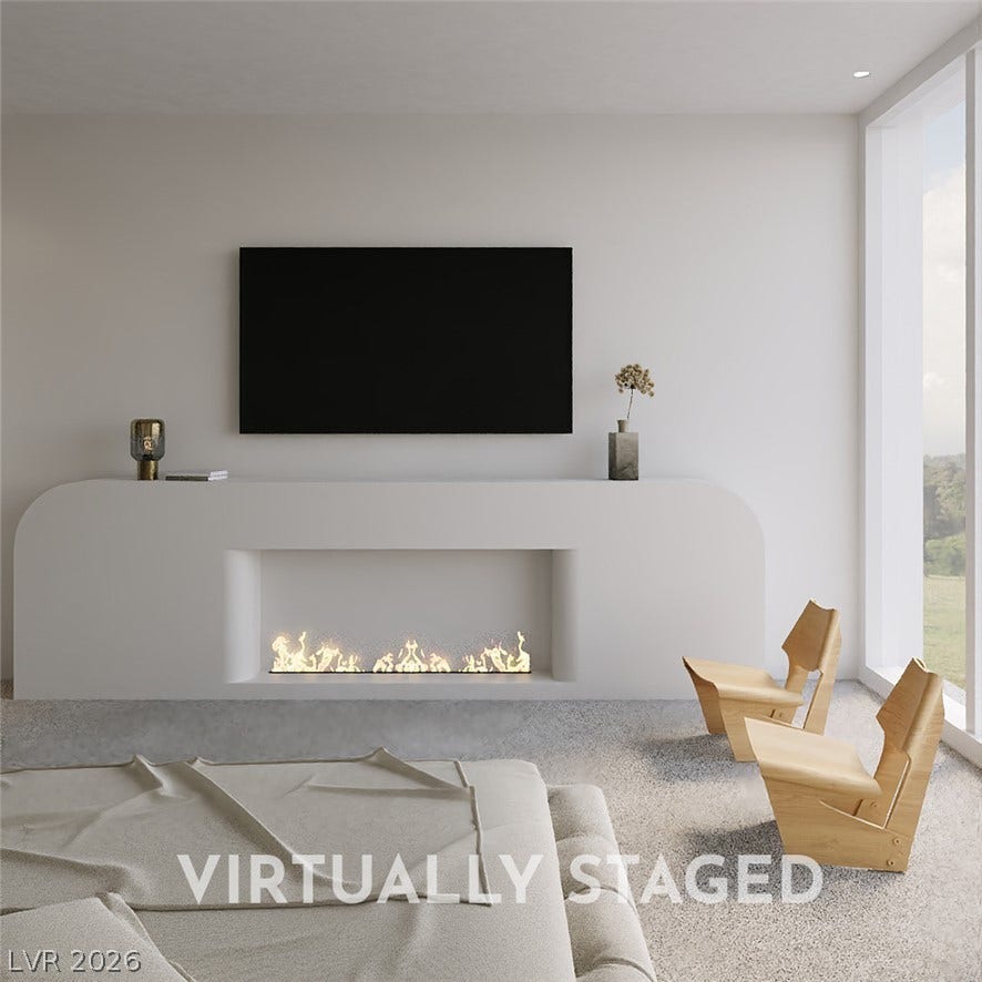410 Net Zero Drive, Henderson, NV 89012 Minimalist architectural lines define this serene space complete with a sleek modern fireplace.