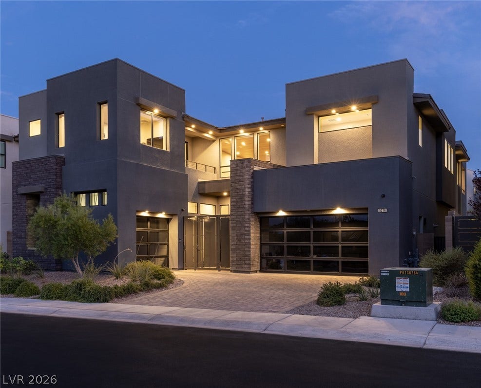5216 Fading Sunset Drive, Las Vegas, NV 89135 Bold contemporary architecture paired with integrated exterior lighting creates remarkable curb appeal.