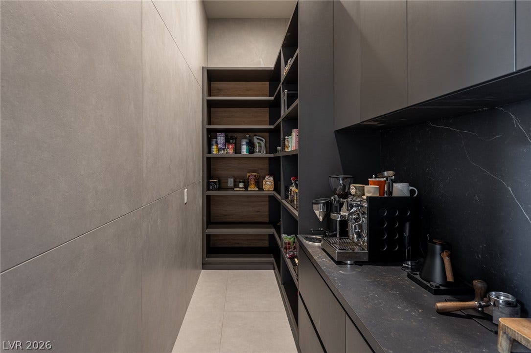 5216 Fading Sunset Drive, Las Vegas, NV 89135 A well-organized pantry offers abundant storage, seamlessly blending functionality with contemporary design.