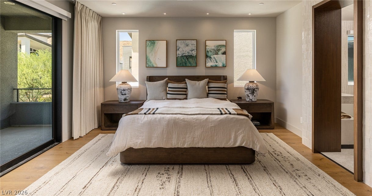 5216 Fading Sunset Drive, Las Vegas, NV 89135 Rich hardwood flooring and recessed lighting define this tranquil bedroom setting.