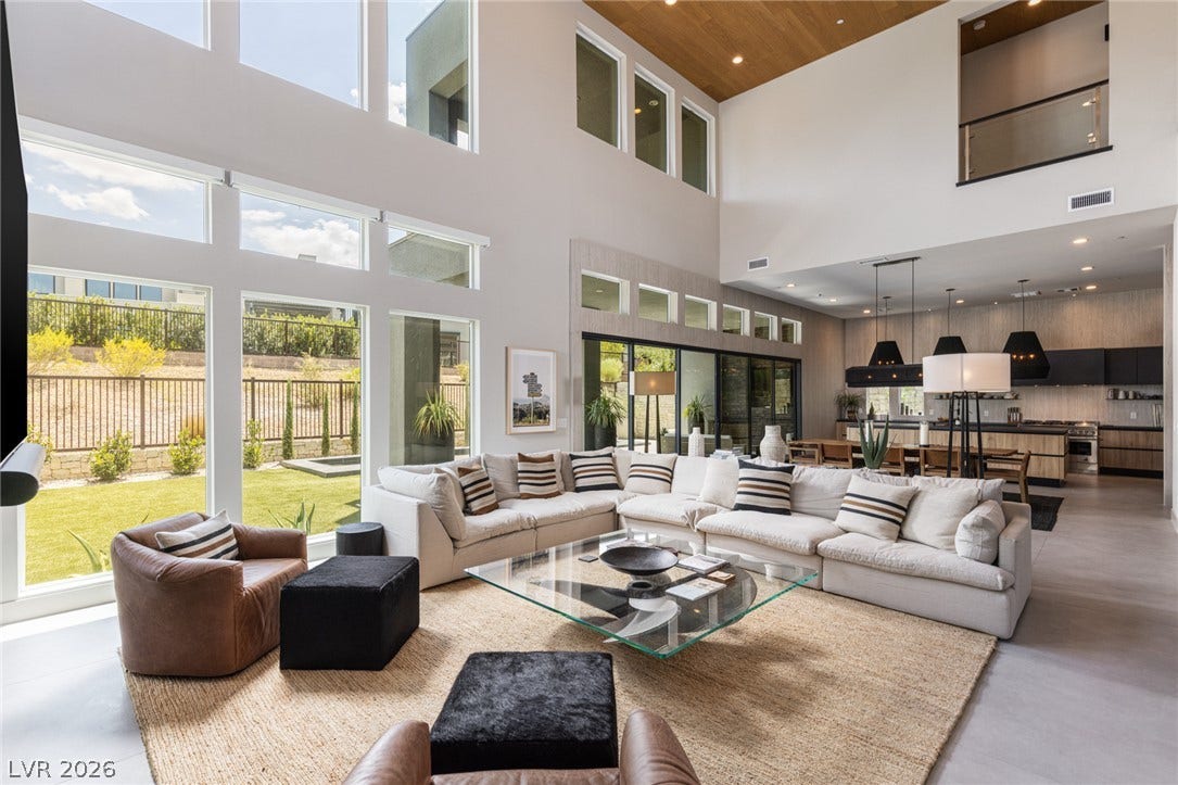5216 Fading Sunset Drive, Las Vegas, NV 89135 A grand living space features soaring ceilings and abundant natural light.