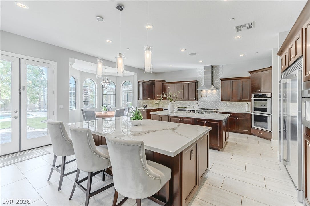 240 San Salvador Avenue, Henderson, NV 89002 Gleaming stone countertops and dual islands highlight this expansive culinary space.