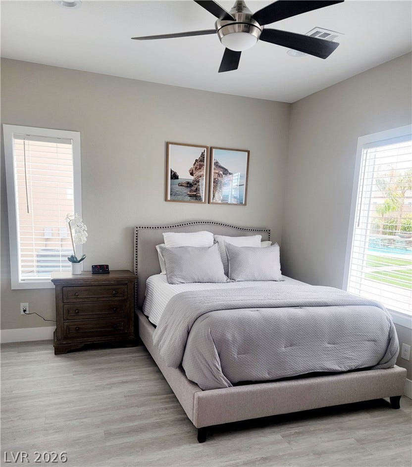 240 San Salvador Avenue, Henderson, NV 89002 Casita bedroom. Clean lines and wood flooring define this comfortable space lit by large windows.