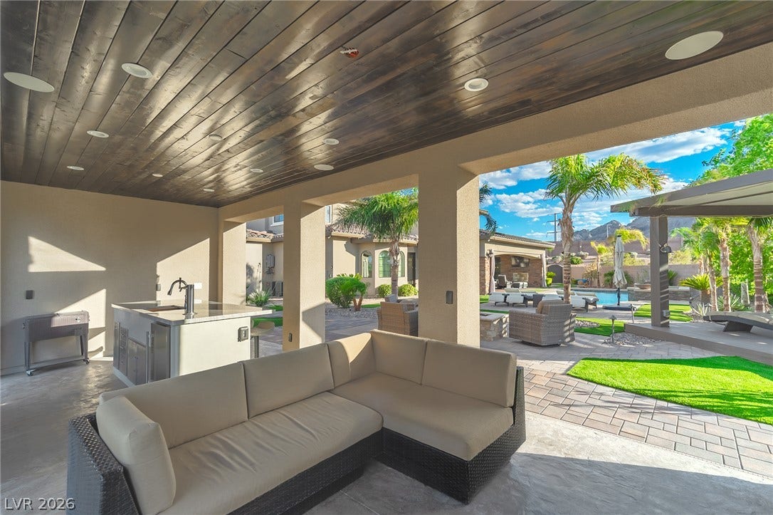 240 San Salvador Avenue, Henderson, NV 89002 Rich wood plank ceilings shelter a spacious covered patio overlooking the sparkling pool.