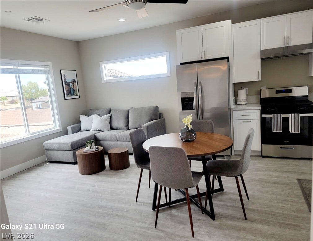 240 San Salvador Avenue, Henderson, NV 89002 Casita dining/kitchen area. Modern wood-look flooring define this bright, open-concept living and dining space.