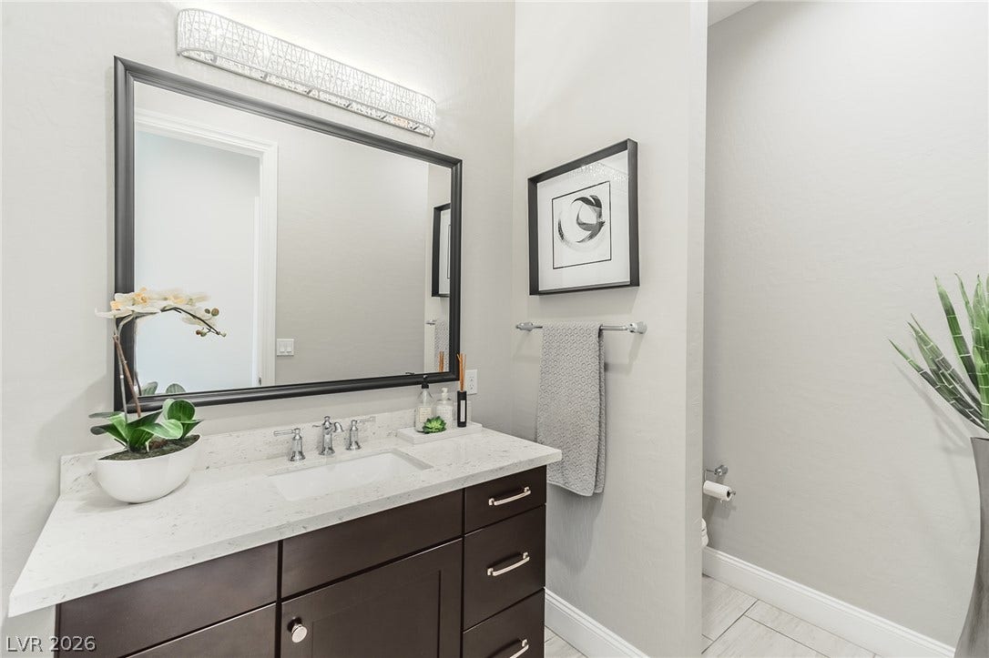 240 San Salvador Avenue, Henderson, NV 89002 Powder room. Elegant stone countertops and clean tile flooring define this beautifully appointed powder room.