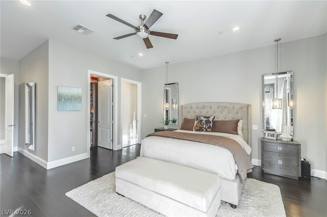 240 San Salvador Avenue, Henderson, NV 89002 Rich hardwood flooring pairs beautifully with the modern layout of this main-level bedroom.