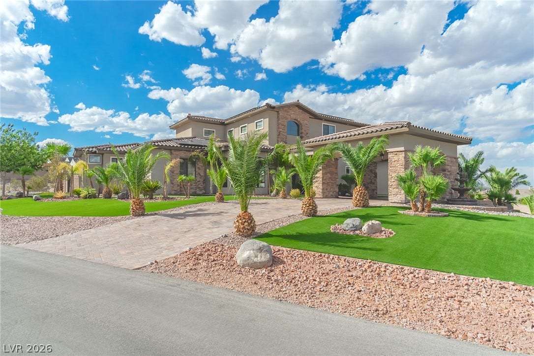 240 San Salvador Avenue, Henderson, NV 89002 Palm trees frame a grand paver driveway leading to this magnificent multi-level desert estate.