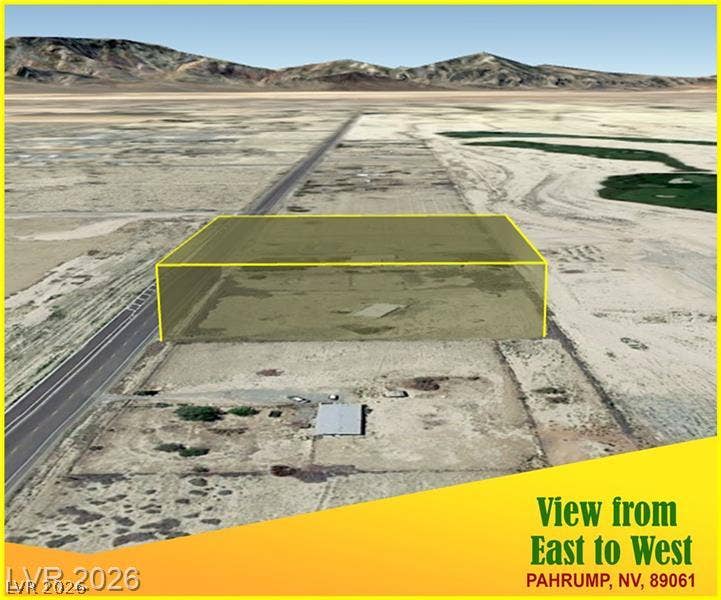 000 Linda Leslie Manse Street, Pahrump, NV 89060 An expansive desert lot bordered by paved roads offers mountain views in the distance.