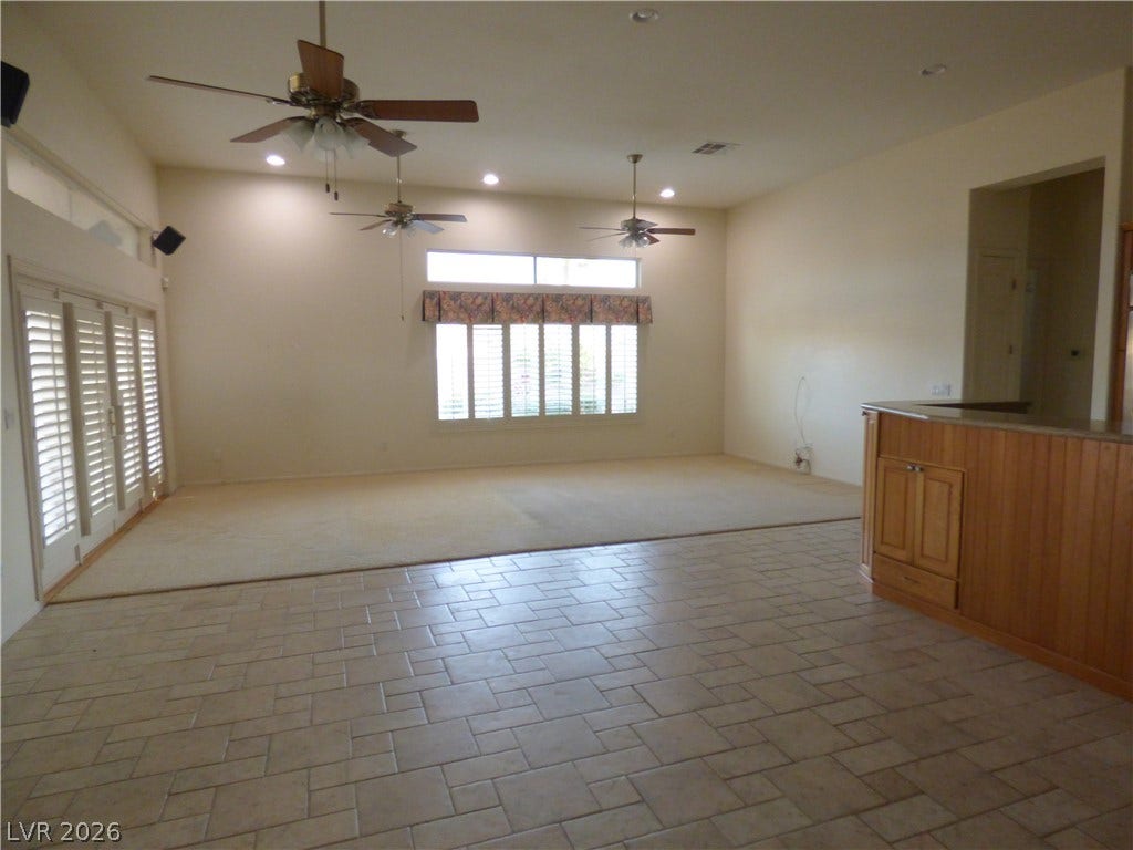 7695 Gilespie Street, Las Vegas, NV 89123 An open living layout links tiled and carpeted spaces beneath high ceilings.