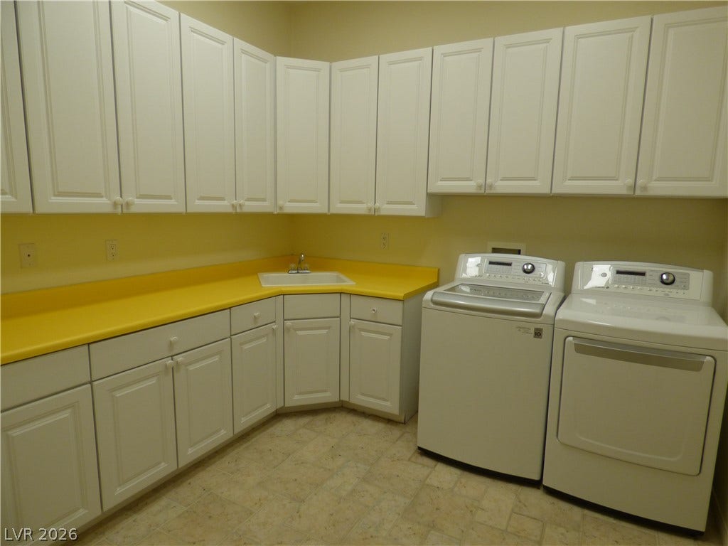 7695 Gilespie Street, Las Vegas, NV 89123 Ample cabinetry and functional workspace define this practical utility area.
