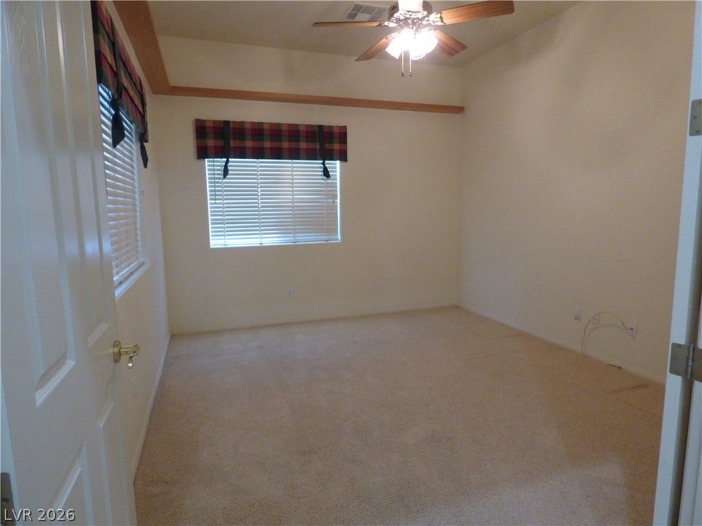 7695 Gilespie Street, Las Vegas, NV 89123 A classic tray ceiling detail anchor this comfortable secondary bedroom/den/office with adjacent full bath.