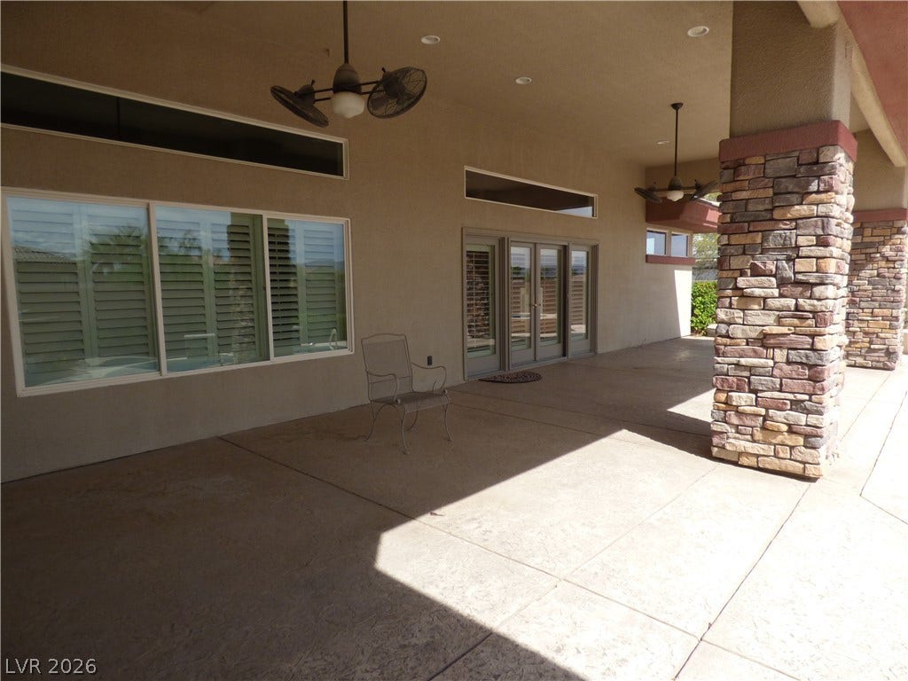 7695 Gilespie Street, Las Vegas, NV 89123 Massive stone columns support the covered back patio overlooking the outdoor living space.