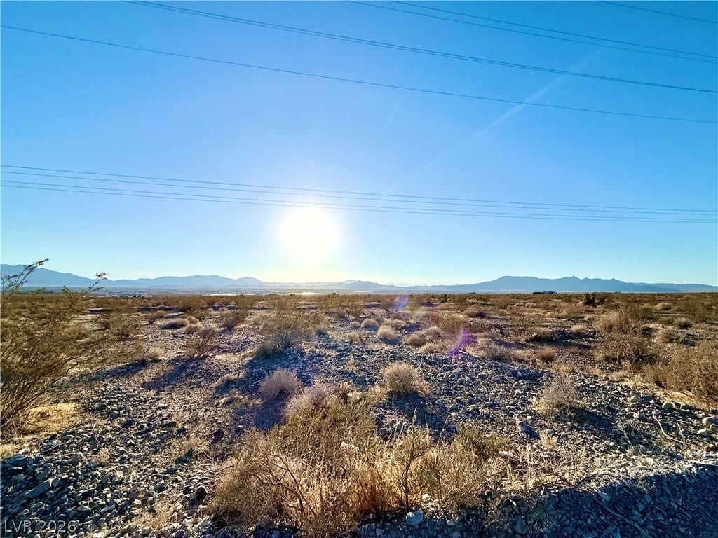 180 N Higley Road, Pahrump, NV 89060 Distant mountains frame a wide desert landscape under a bright, open sky.
