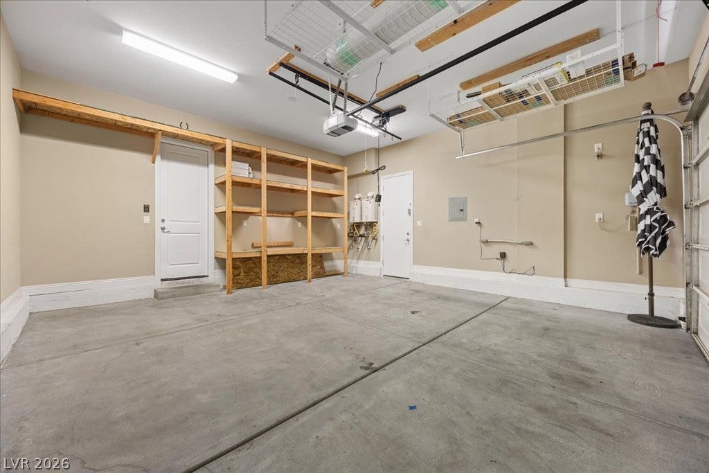12021 Abbracci Avenue, Las Vegas, NV 89138 A well-organized garage with ample built-in shelving and overhead storage solutions.