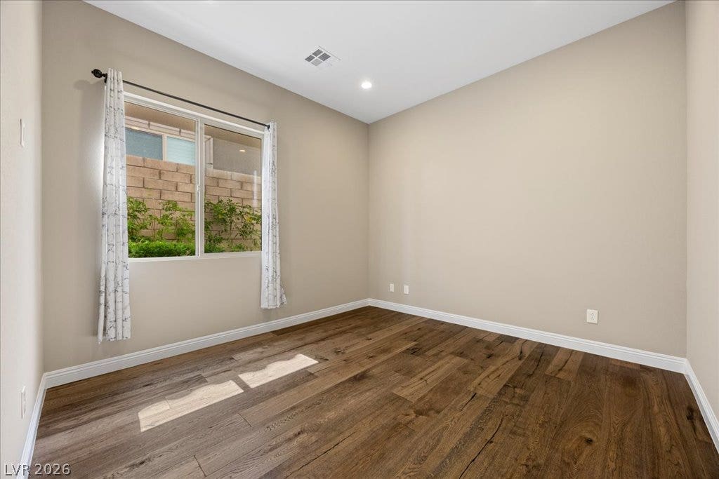 12021 Abbracci Avenue, Las Vegas, NV 89138 Wood flooring and ample natural light define this versatile room, ready for your personalized touch.