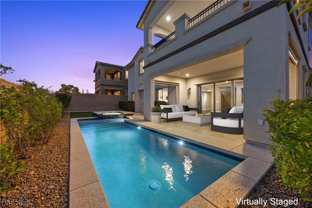 12021 Abbracci Avenue, Las Vegas, NV 89138 Virtually Staged An inviting backyard oasis features a shimmering pool, relaxing spa, and cozy outdoor living area.