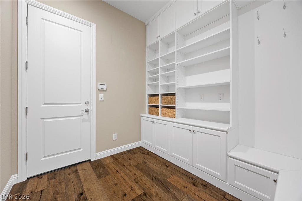 12021 Abbracci Avenue, Las Vegas, NV 89138 Functional mudroom with built-in shelving, cabinet storage, and comfortable bench seating.