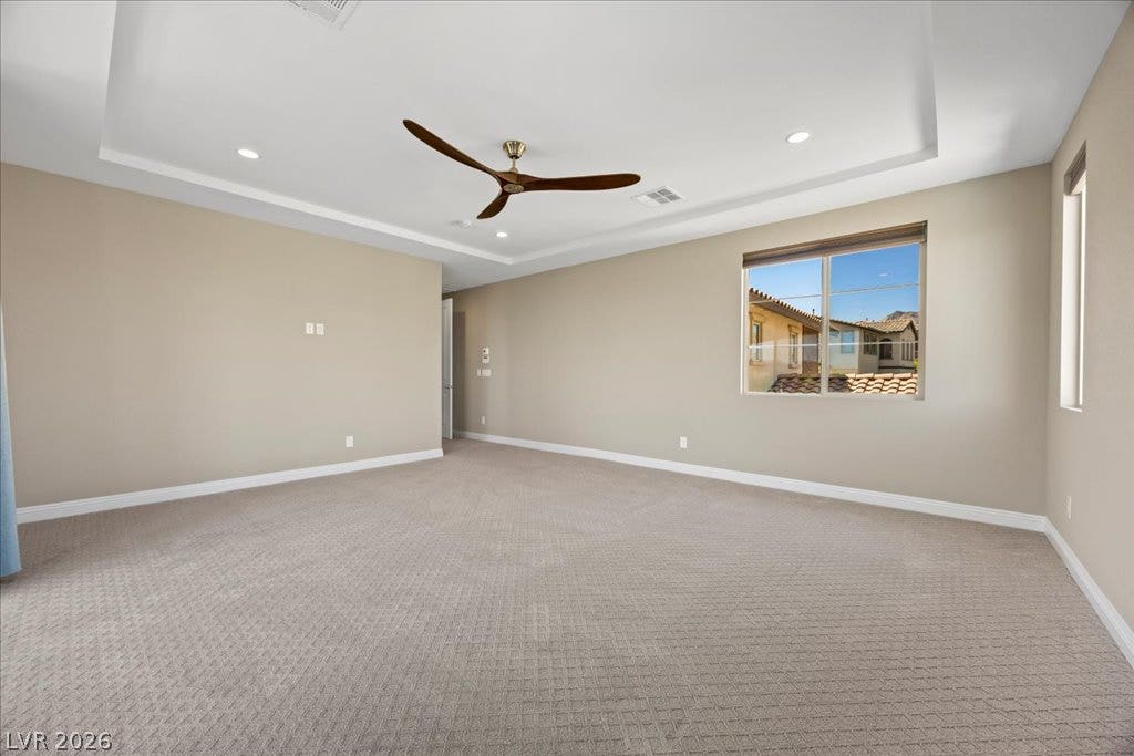 12021 Abbracci Avenue, Las Vegas, NV 89138 A spacious chamber presents a coffered ceiling, recessed lighting, and a modern ceiling fan for ultimate comfort.