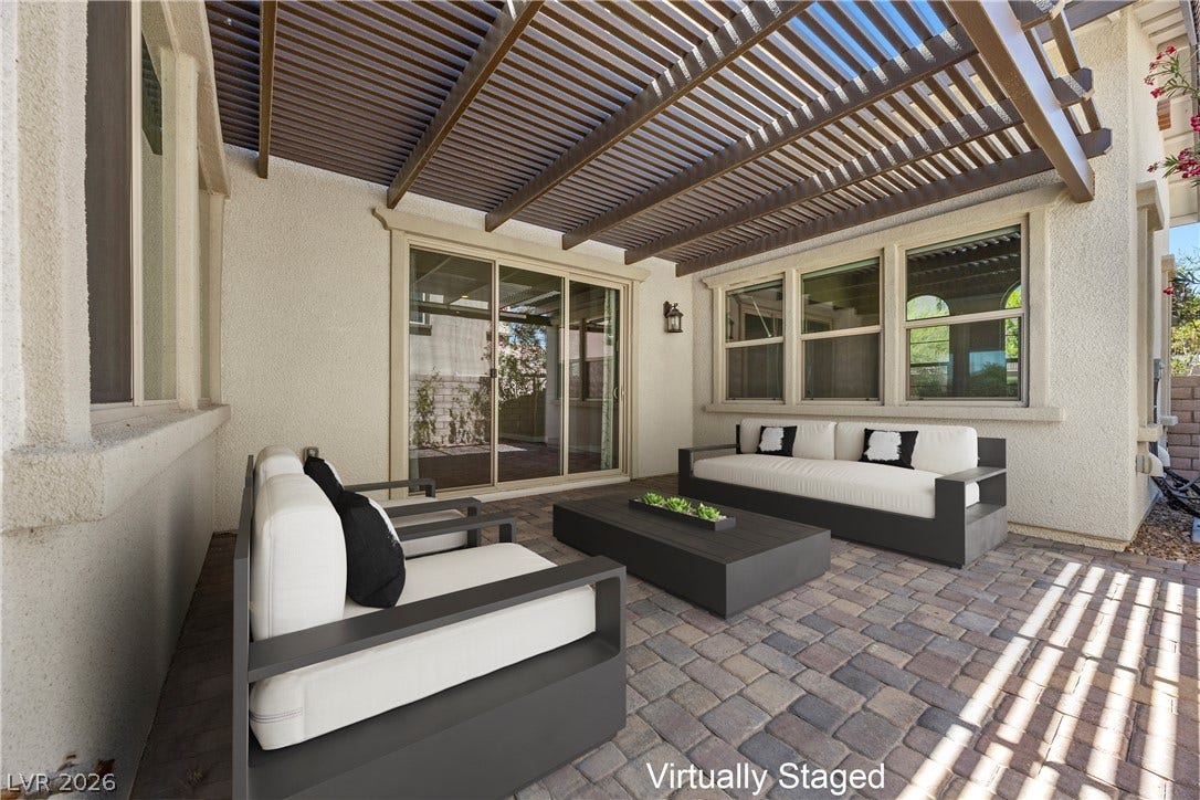 12021 Abbracci Avenue, Las Vegas, NV 89138 Virtually Staged Enjoy outdoor living with this covered patio, ideal for relaxing or entertaining guests.
