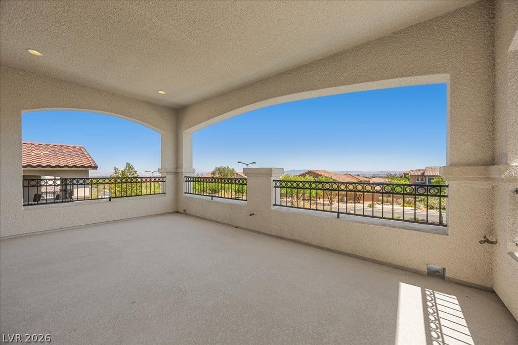 12021 Abbracci Avenue, Las Vegas, NV 89138 An inviting covered deck offers sweeping panoramic views of the surrounding hills.