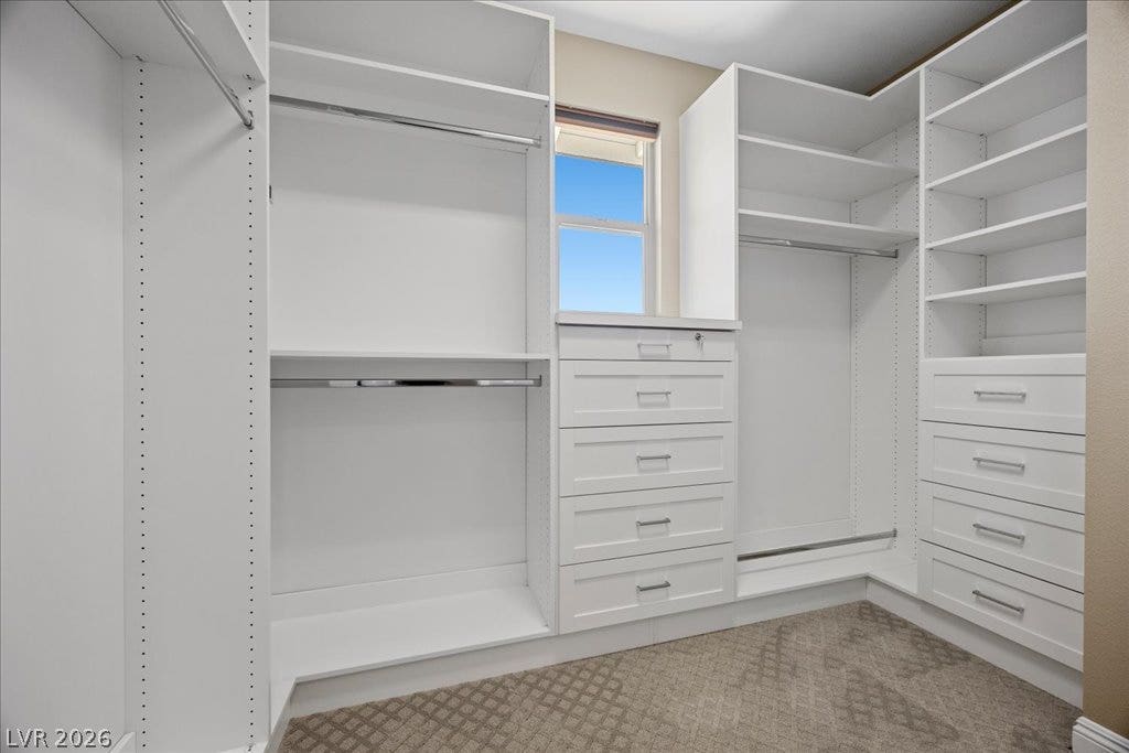 12021 Abbracci Avenue, Las Vegas, NV 89138 Ample custom built-in cabinetry and hanging storage create a highly functional closet space.