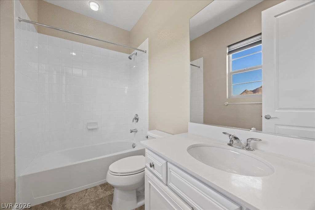 12021 Abbracci Avenue, Las Vegas, NV 89138 White subway tile and a modern vanity create a clean, contemporary bathroom.