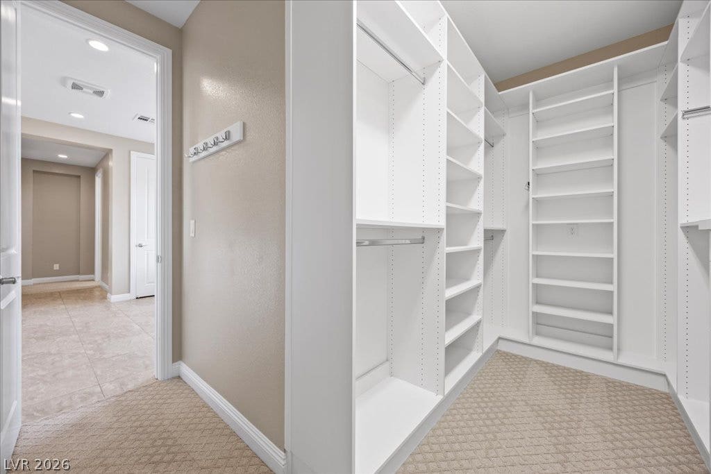 12021 Abbracci Avenue, Las Vegas, NV 89138 Discover abundant storage within this thoughtfully organized walk-in closet.
