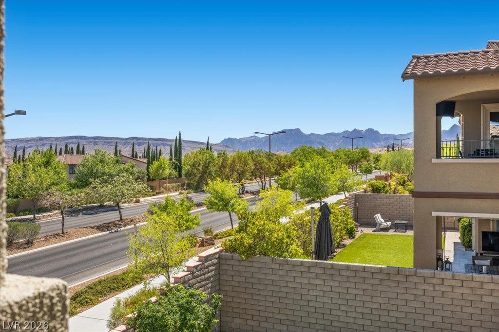 12021 Abbracci Avenue, Las Vegas, NV 89138 Enjoy scenic mountain views and verdant landscaping from this outdoor patio space.