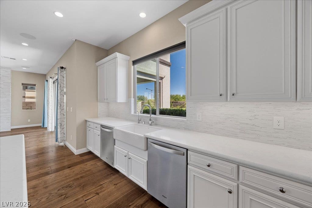 12021 Abbracci Avenue, Las Vegas, NV 89138 Culinary creations come to life in this naturally illuminated kitchen, featuring sleek stainless steel appliances.
