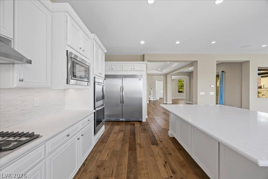 12021 Abbracci Avenue, Las Vegas, NV 89138 Culinary delights await in this bright kitchen with premium appliances and a generous island.