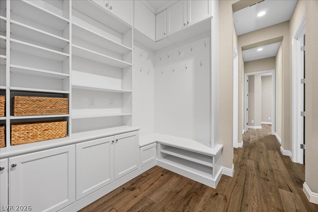 12021 Abbracci Avenue, Las Vegas, NV 89138 Functional mudroom with built-in shelving, seating, and convenient hallway access.