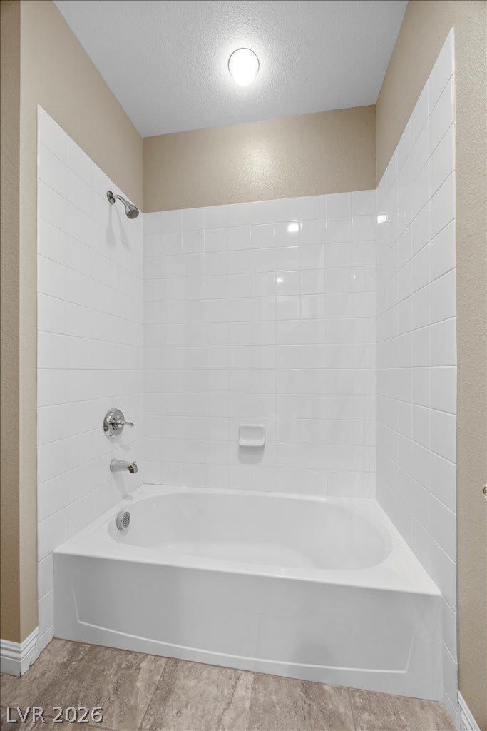 12021 Abbracci Avenue, Las Vegas, NV 89138 A well-maintained bathroom featuring a classic tub and shower combination with clean tile.