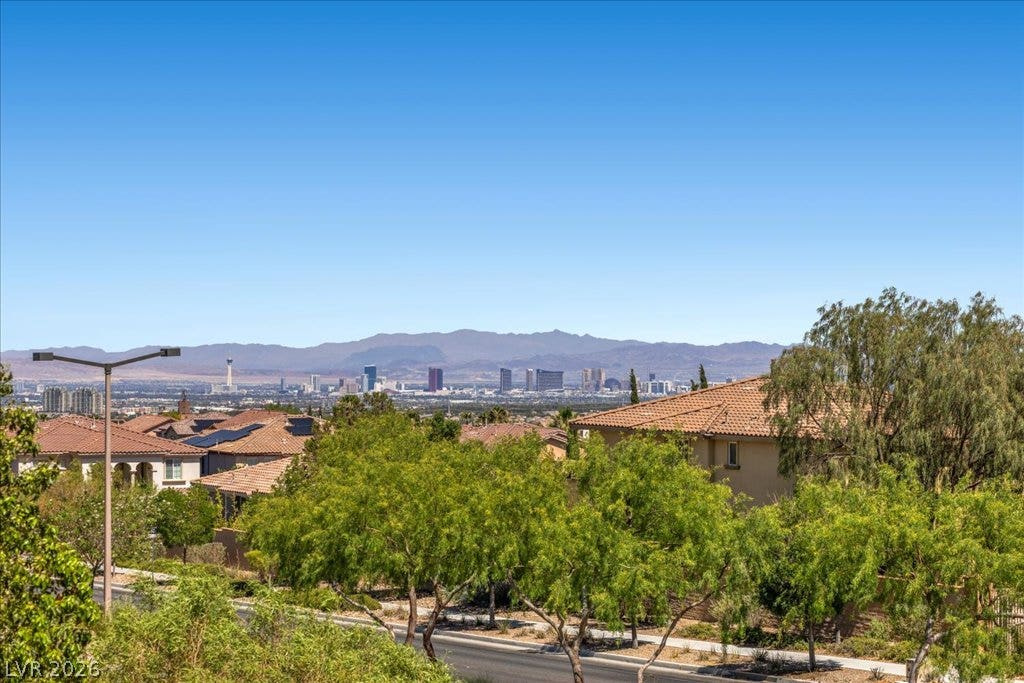 12021 Abbracci Avenue, Las Vegas, NV 89138 Panoramic views sweep across the vibrant cityscape and distant mountains from this elevated neighborhood.