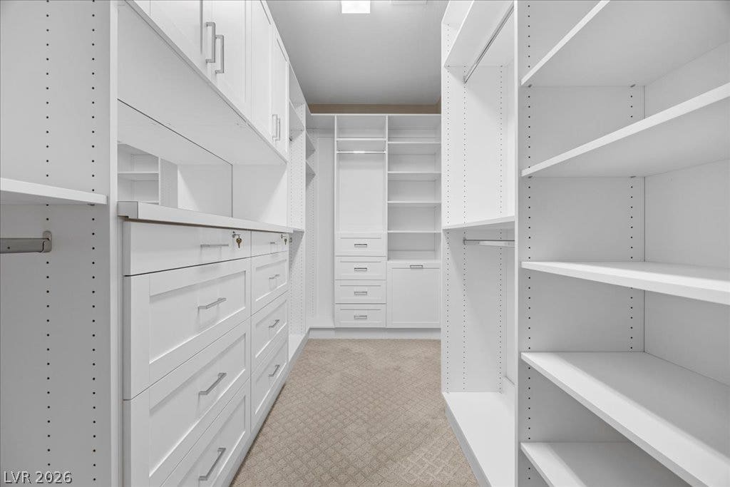 12021 Abbracci Avenue, Las Vegas, NV 89138 Custom shelving and drawers offer extensive organization in this well-appointed closet.