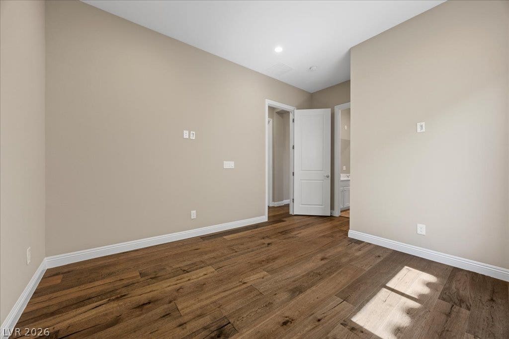 12021 Abbracci Avenue, Las Vegas, NV 89138 Rich hardwood flooring extends throughout this versatile, well-proportioned room with a doorway leading to an adjacent space.