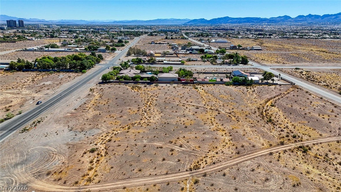 Pebble Road, Las Vegas, NV 89124 Panoramic mountain and city views frame this expansive desert acreage primed for development.