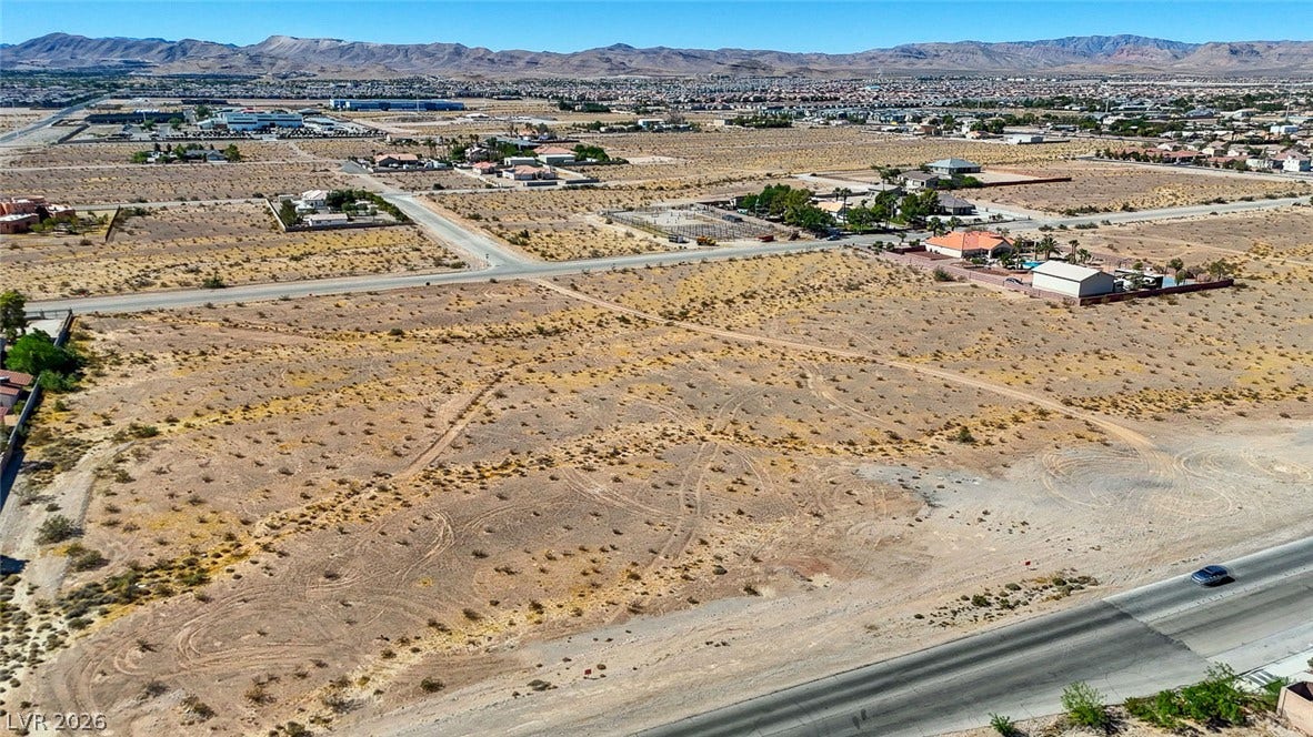 Pebble Road, Las Vegas, NV 89124 Vast desert acreage offers endless possibilities against a backdrop of majestic mountain ridges.