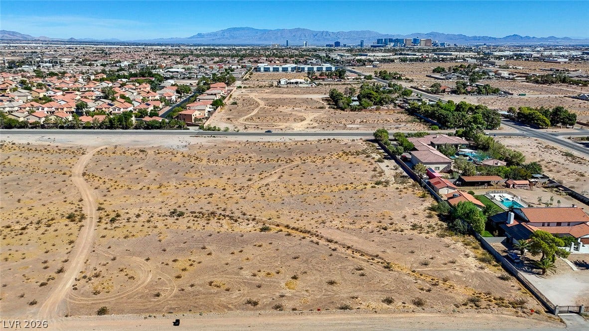 Pebble Road, Las Vegas, NV 89124 Distant skyline vistas frame this expansive desert parcel situated near established residential developments.