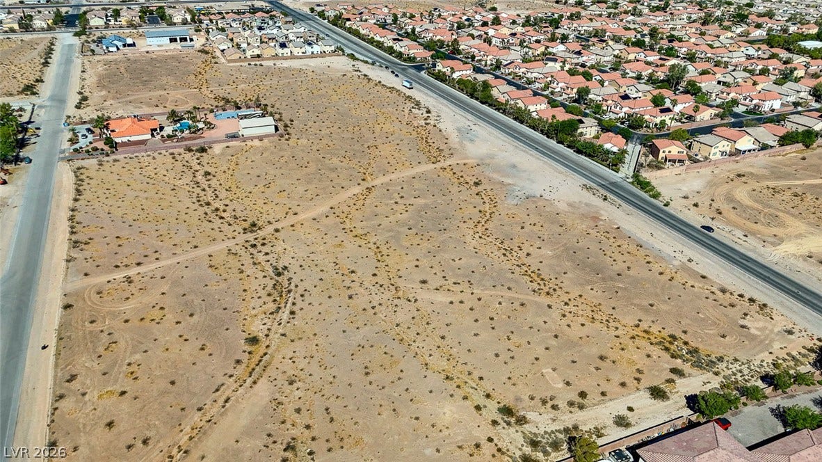 Pebble Road, Las Vegas, NV 89124 An expansive desert parcel offers developmental potential alongside established residential neighborhoods.
