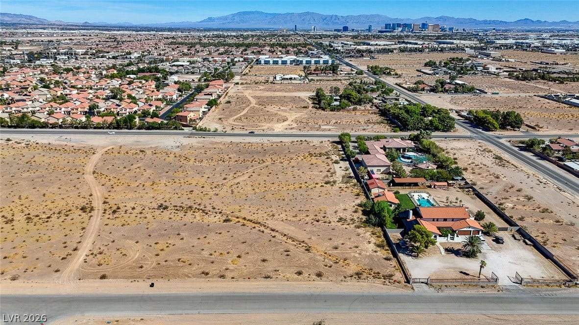 Pebble Road, Las Vegas, NV 89124 Distant mountain and city skyline views frame this expansive desert parcel.